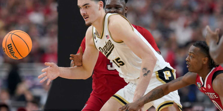 Zach Edey leads Purdue past NC State in Final Four to reach title game.